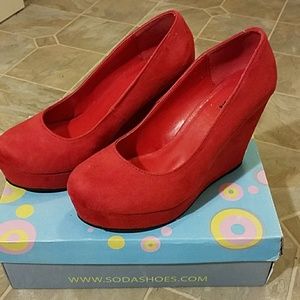 Red wedge pumps